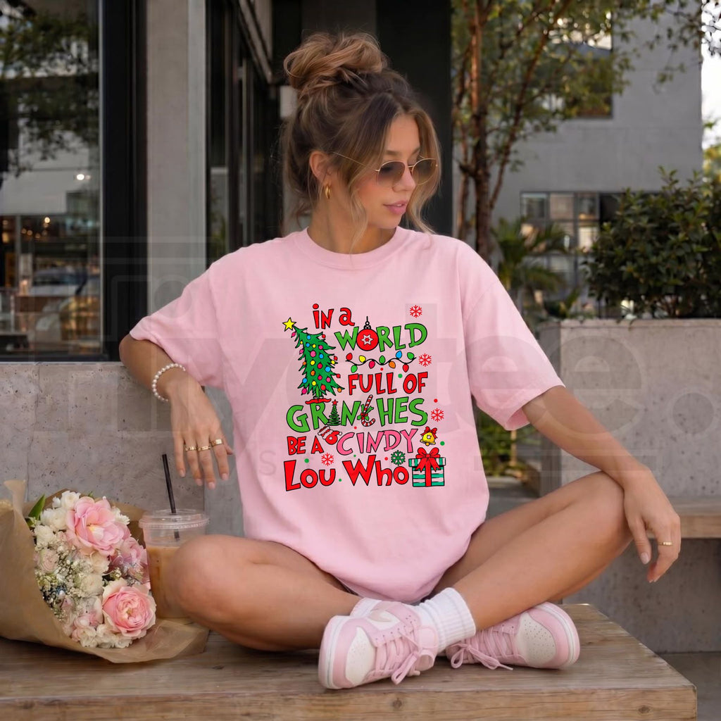 In a World Full of Grinches Be a Cindy Lou Who T-Shirt – Inspirational Christmas Holiday Graphic Tee